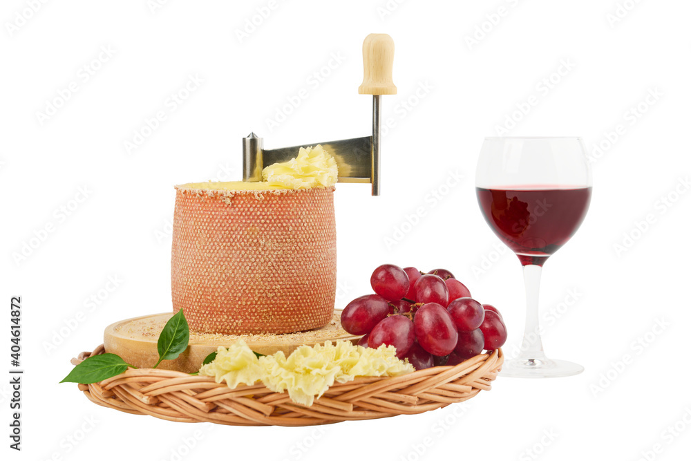 Φωτογραφία Gourmet tasty cheese Tete de Moine, a glass of red wine and a bunch of grapes is