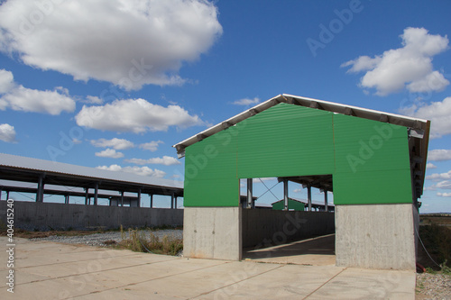 Hangar warehouse. Construction of hangars from a metal frame and modern wall material from sandwich panels. Prefabricated buildings from frame and panels © Vasiliy Ulyanov