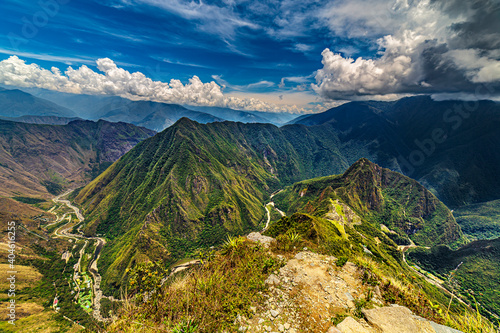 Peru, Cusco Region. Historic Sanctuary of Machu Picchu (right side) seen from Machu Picchu Mountain. There are Huayna Picchu raised above the Inca city, Urubamba River below and Hidroelectrica in left