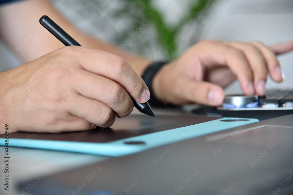 Designer drawing on graphic tablet Designer drawing on graphic tablet