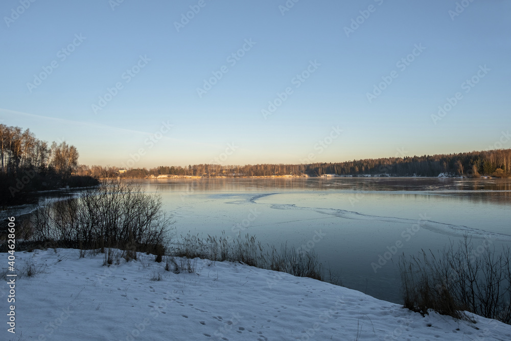 Ice on the Uvod reservoir on a sunny winter day, Ivanovo region.