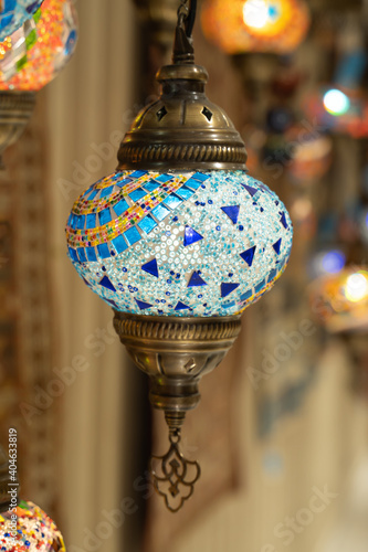 Turkish mosaic lamp rug in the background. glass lamp mosaic chandelier glass in grand bazaar.  