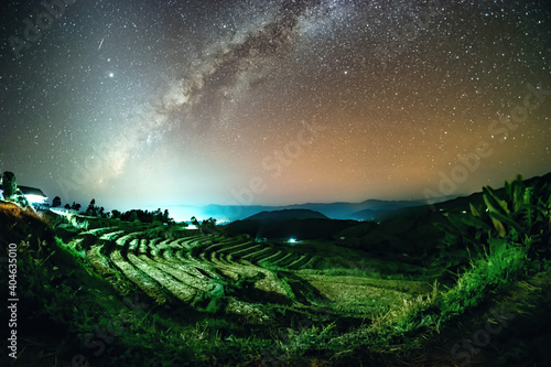 Milky Way and the Zodiac light in the early in the evening of November at Ban Pa Bong Piang Jomthong, Chiang Mai, Thailand. photo