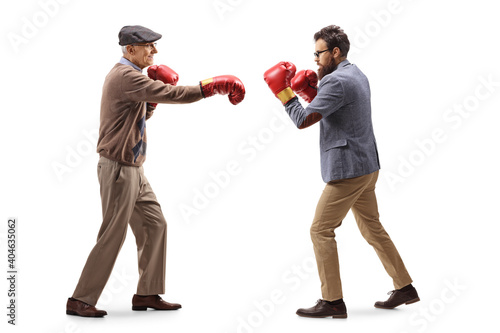 Elderly father and son fighting with boxing gloves