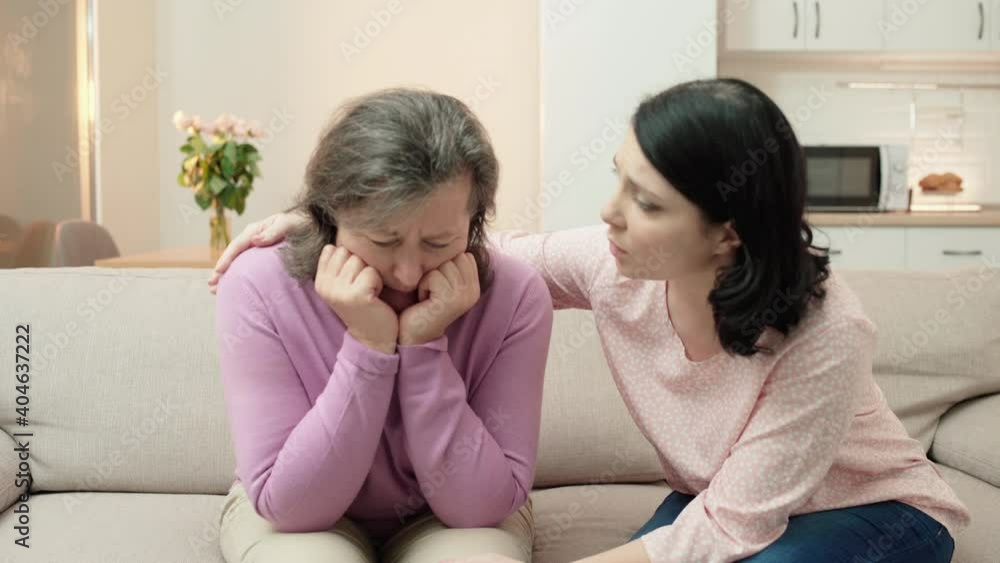 Daughter hugging sad senior mother, supporting depressed woman, togetherness Daughter hugging sad senior mother, supporting depressed woman, togetherness