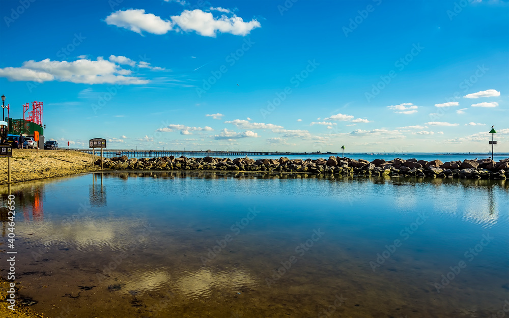 A view across the beach lagoon towards the longest pleasure pier in the world at Southend-on-Sea, UK in Autumn A view across the beach lagoon towards the longest pleasure pier in the world at Southend-on-Sea, UK in Autumn