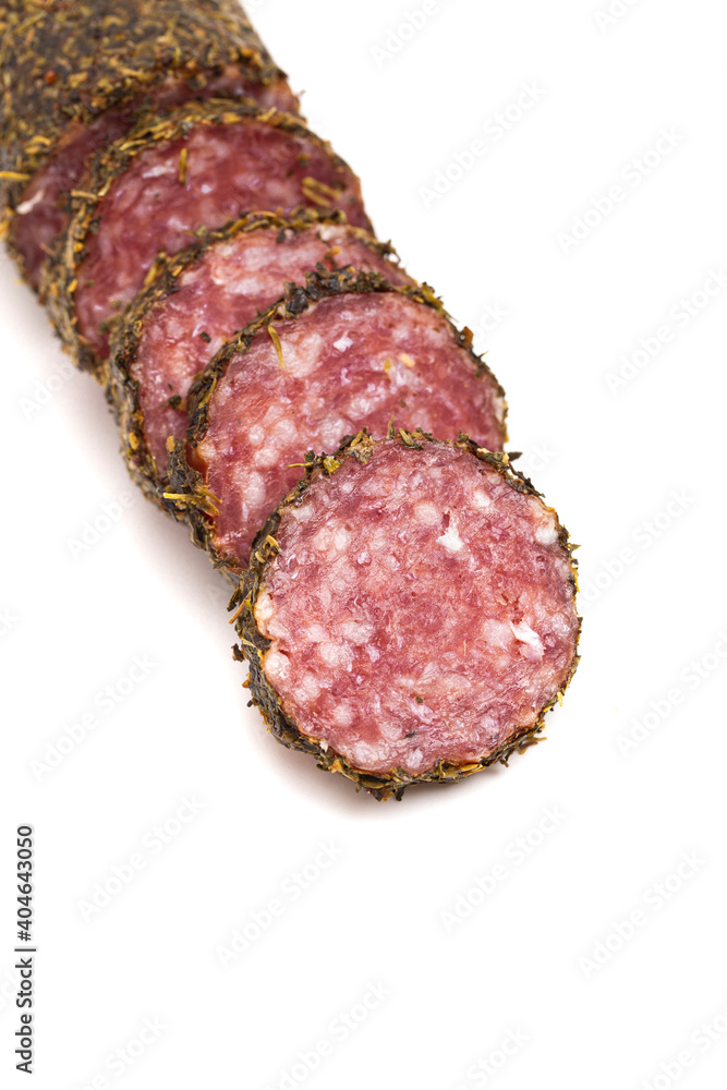 Log of Salami Coated in Herbs and Isolated on a White Background Log of Salami Coated in Herbs and Isolated on a White Background