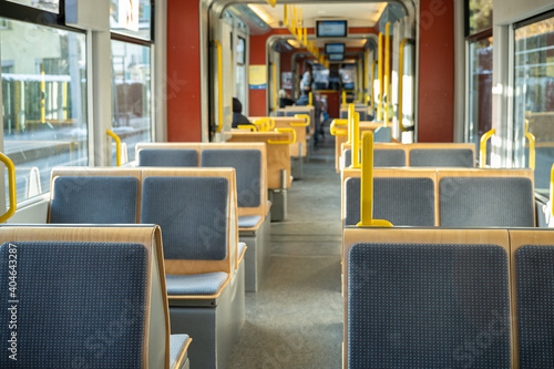 Empty wooden seats in the urban tram car