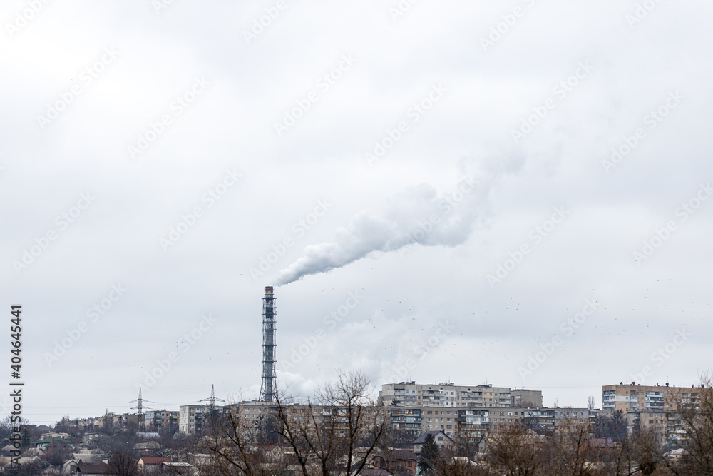air pollution concept. factory smoke in city space. dramatic cloudy sky. ecology problem conceptual
