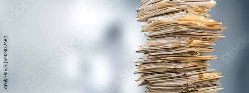 Stack file folders with documents on the desk photo