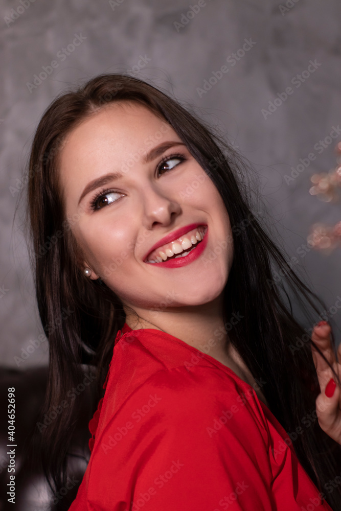 portrait of attractive brunette woman in red blouse. st valentines portrait of attractive brunette woman in red blouse. st valentines