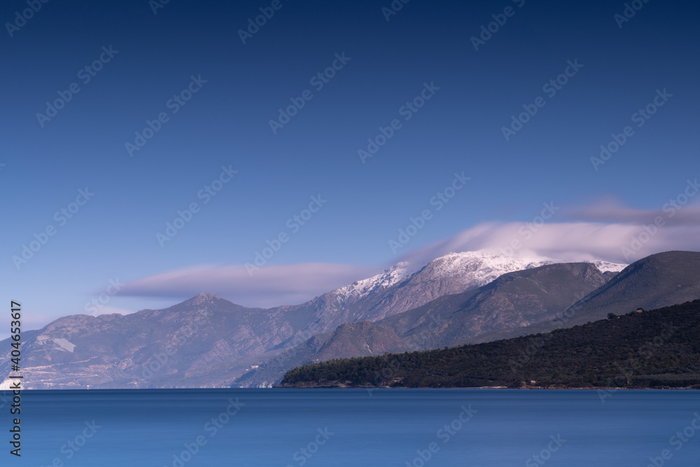 Blue sea and snow covered mountains of the Cap Corse.