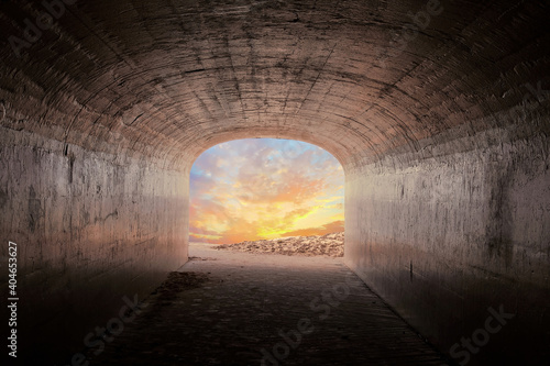 dark concrete tunnel with glowing sunrise cloudscape 
