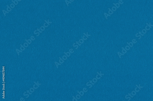 Clean blue retro paper background. Vintage cardboard texture. Grunge paper for drawing. Simple blank fabric pattern.