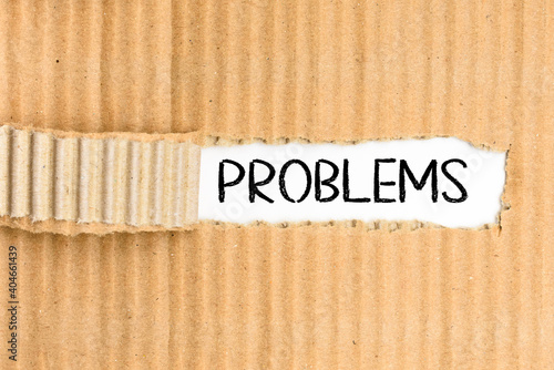 Problems, slogan for finding solutions during a meeting, word written on a torn piece of cardboard in a folder.