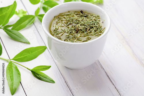 cup of fresh tea  fresh tea leaves. herbal infusion. green tea