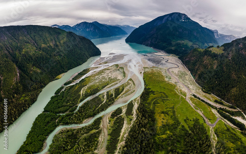 Delta of glacial river with green grass aerial view