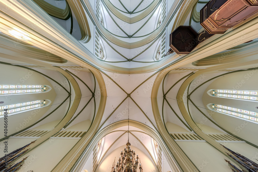 interior and dome and looking up into a old catholic baroque church ceiling