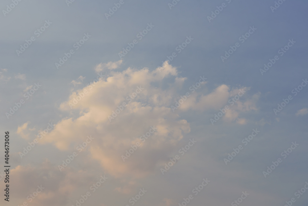 Blue sky with white fluffy clouds and sunlight before sunset Blue sky with white fluffy clouds and sunlight before sunset