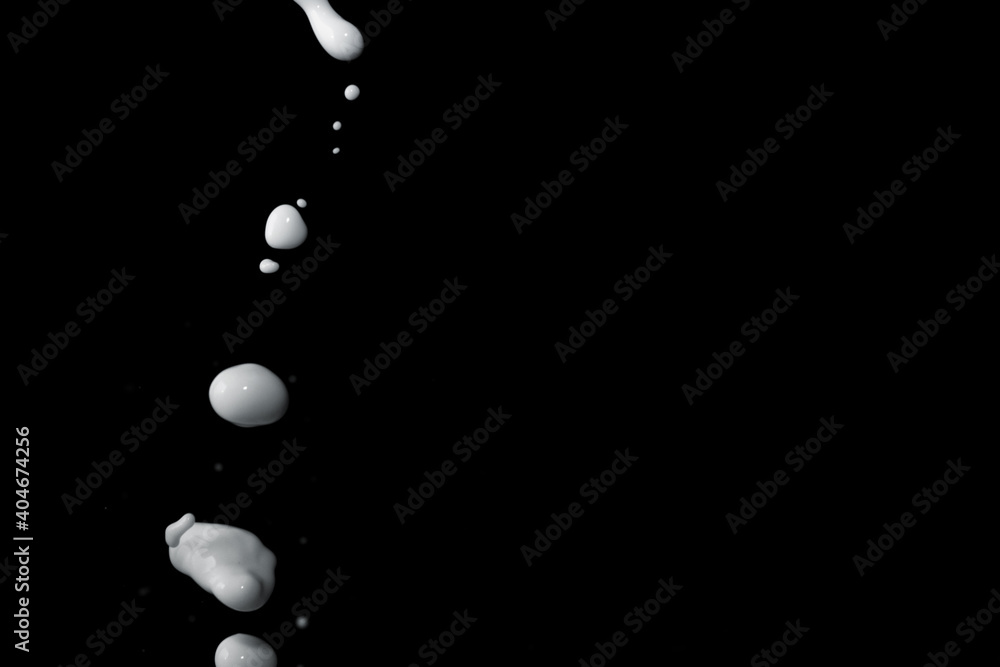 Milk splash on black background Milk splash on black background