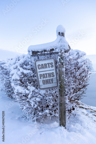 snow covered sign © DesignFlip