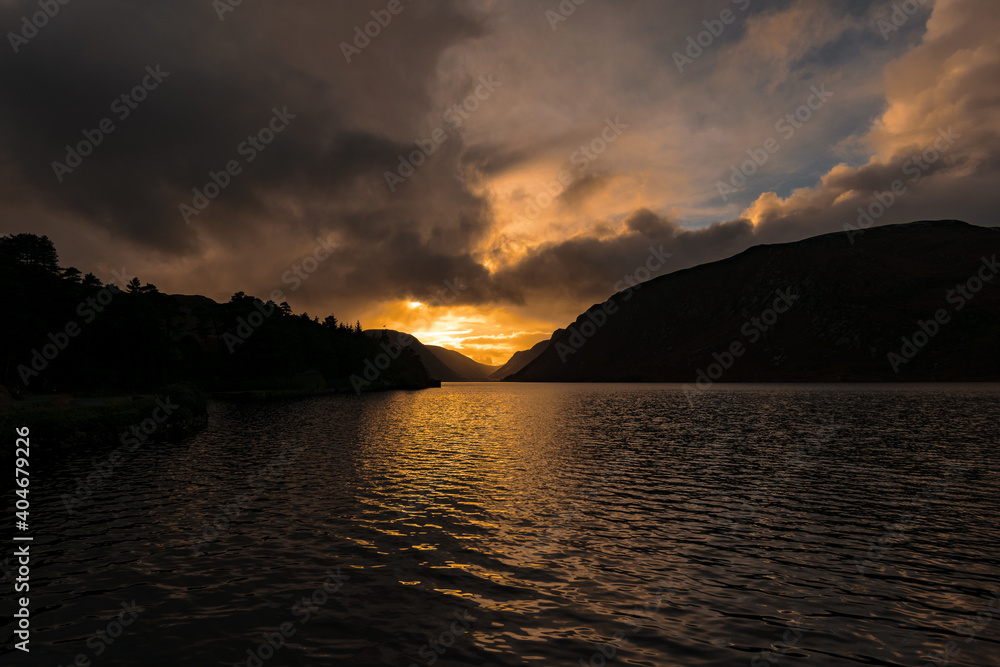 Spectacular view in Glenveagh National Park, orange sunset with fluffy clouds, Lough Veagh and rugged Derryveagh Mountains, Church Hill, Letterkenny, Co. Donegal, Ireland