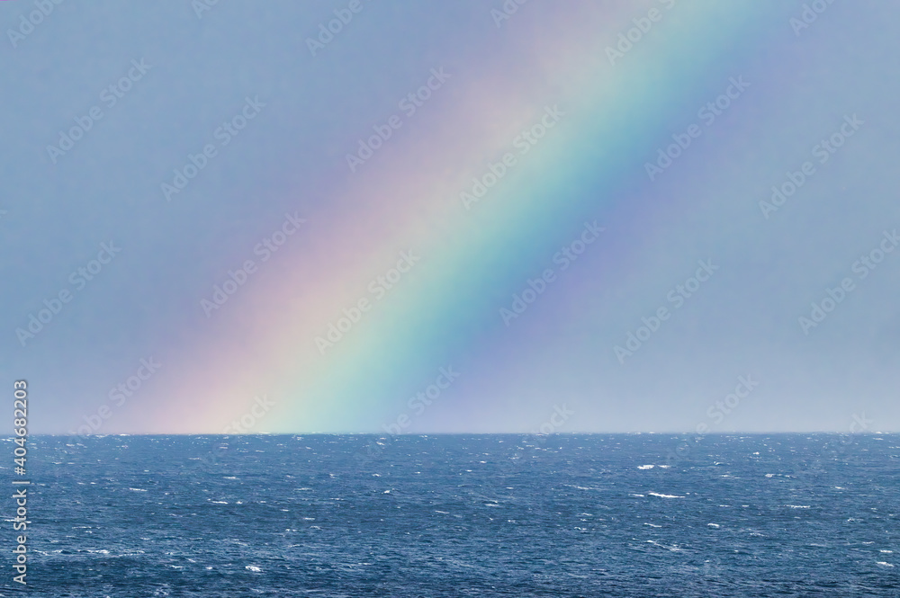 Brilliant rainbow over the ocean on Maui.