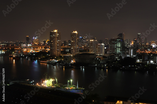 Aerial View of Condominium, Living place in Bangkok City Downtown with Night View, Night cityscape chao Phraya river in Bangkok ,Thailand. © Yuphayao Pooh's