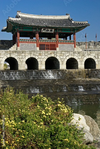 In Suwon, South Korea, at Hwaeseong Fortress is Hwahongmun, a tile-roofed water gate with stone arches on the Gwanggyo stream.