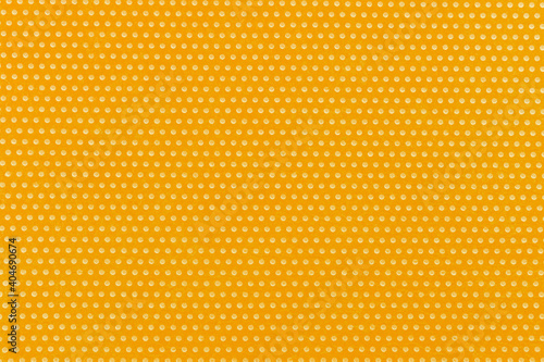 Textile background  yellow with a print in white polka dots.