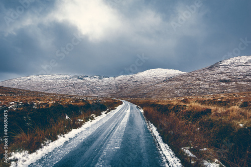 Iced road between Derryveagh Mountains in Glenveagh National Park north west of County Donegal, Ireland photo