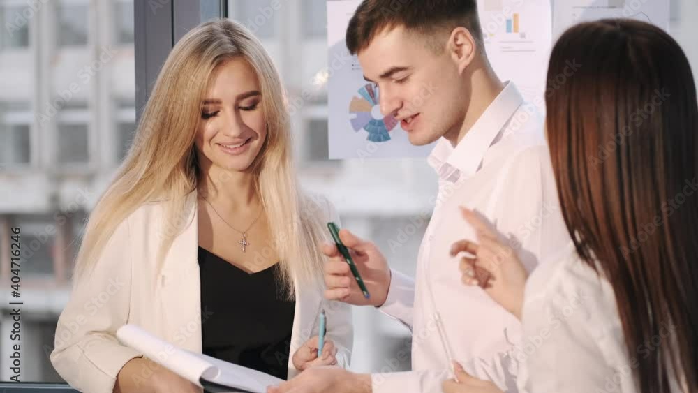 Business team discussing financial documents at workplace. Official style. Business team discussing financial documents at workplace. Official style.