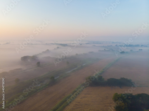 Morninng sunnrise on rice field with fog nature landscape photo