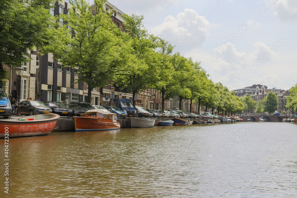 Boats and people along the canals of Amsterdam