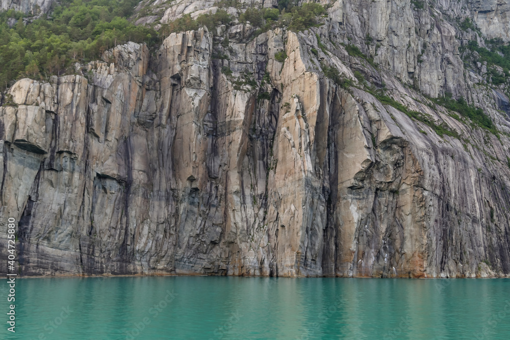 Rock faces along the fjord cliffs and seaside walls of Noway