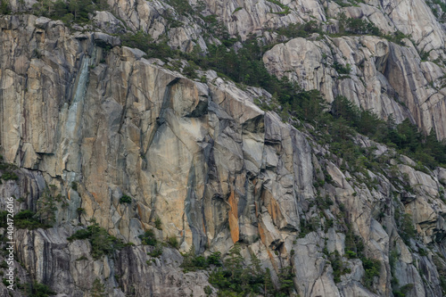 Rock faces along the fjord cliffs and seaside walls of Noway