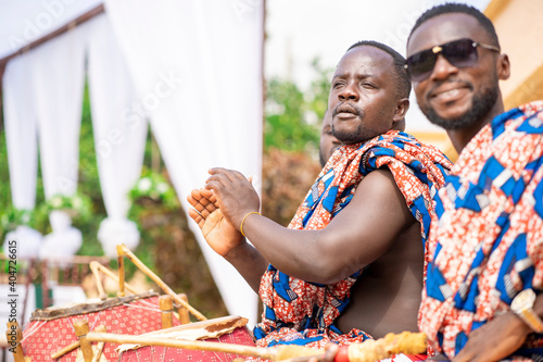 selective focus of traditional african guys, with musical instruments- music concept
 photo