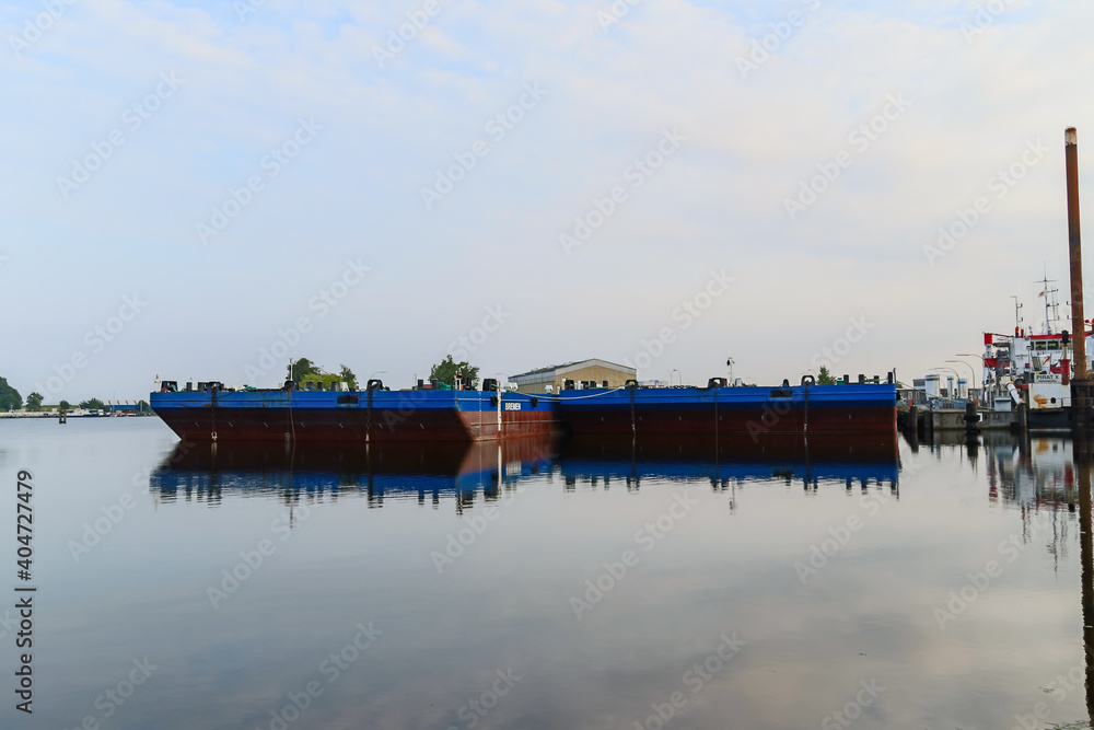 Industrial and commercial vessels in the canals of Wilhelmshaven Germany Industrial and commercial vessels in the canals of Wilhelmshaven Germany
