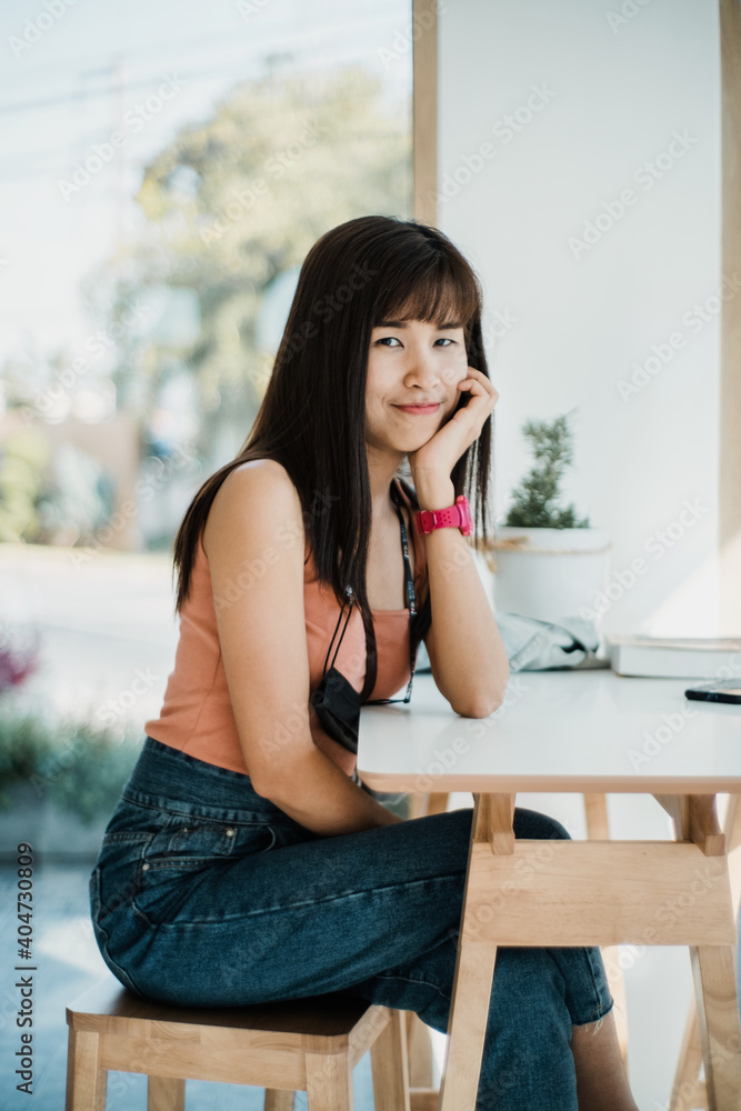 Portrait young woman relaxing is sitting in restaurant. Close up Portrait young woman relaxing is sitting in restaurant. Close up