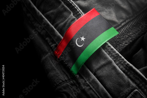Tag on dark clothing in the form of the flag of the Libya