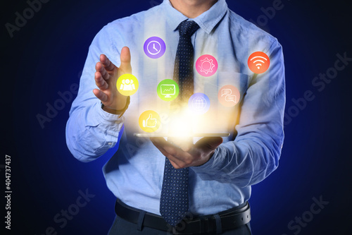 Man with tablet computer us...
