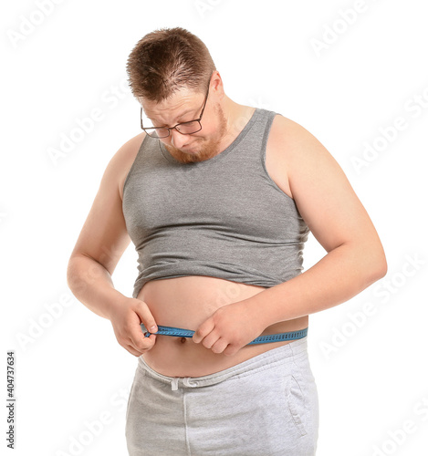 Overweight man with measuri...