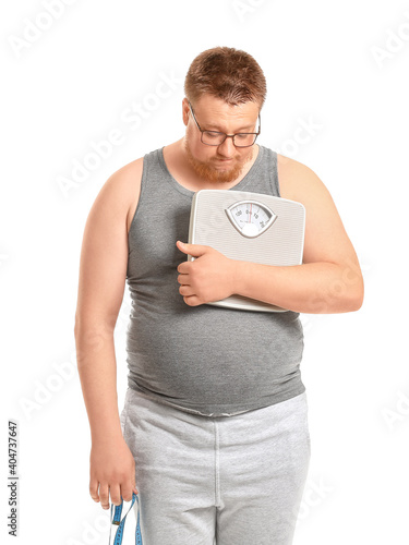 Sad overweight man with sca...