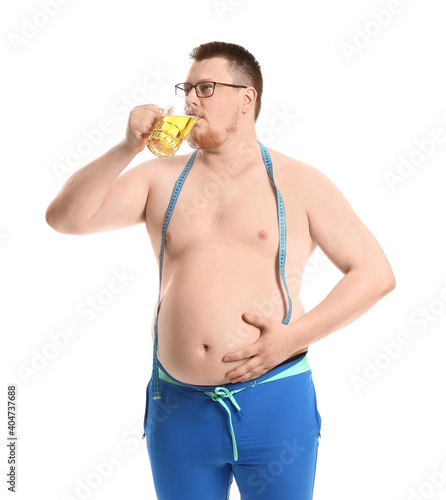 Overweight man with measuri...