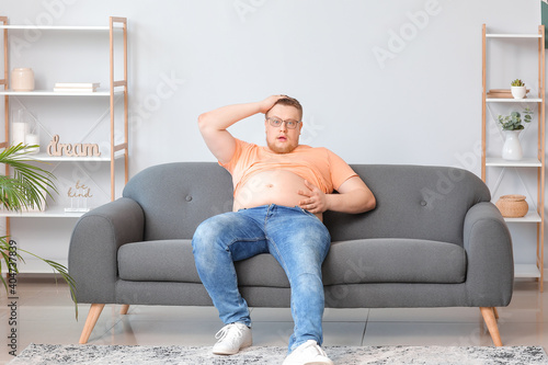 Stressed overweight man at ...