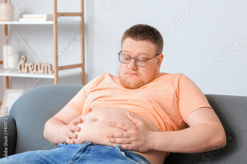 Stressed overweight man at ...