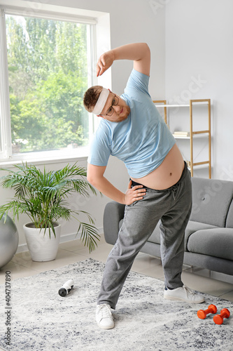 Overweight man training at ...