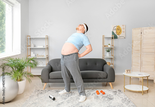 Overweight man training at ...