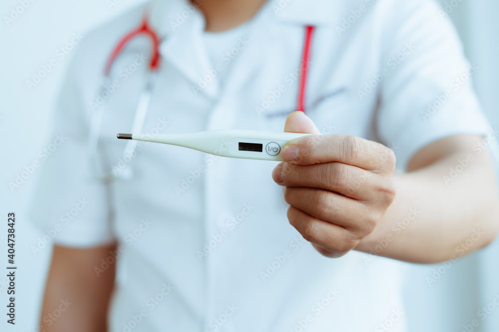 Medical thermometer in palm, hand of a doctor or nurse. Medical thermometer in palm, hand of a doctor or nurse.