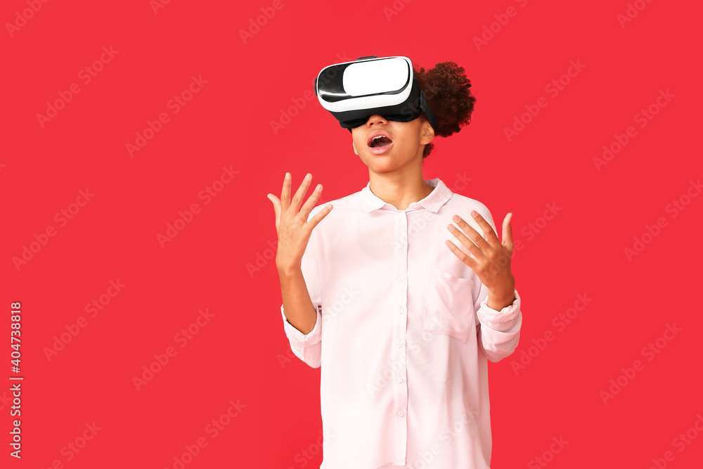 Teenage African-American girl with virtual reality glasses on color background